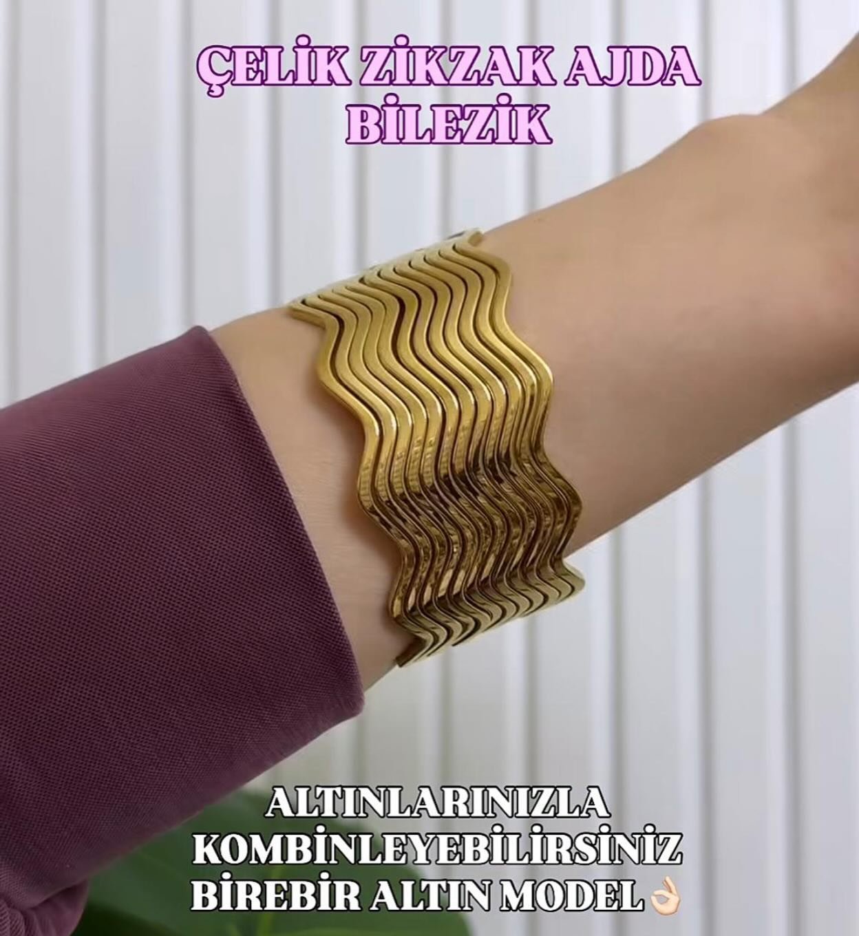 Çelik zikzak desenli, dalgalı formda altın renkli bileklik